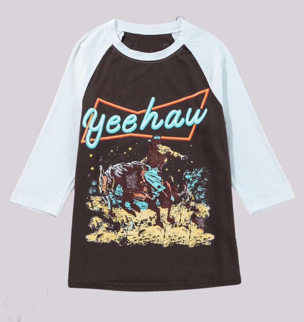 YEEHAW Shirt: This Women&#39;s Western Shirt blends style and comfort with bold &quot;Yeehaw&quot; graphics. Perfect as a Cowgirl Shirt or casual Raglan Sleeve Top, it&#39;s a versatile Women&#39;s Casual T-shirt for rodeos, outings, or everyday Western vibes! SHIPS FREE