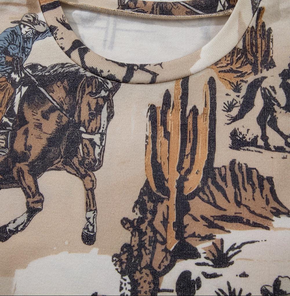 COWBOY T-Shirt for Women! This Western T-Shirt features a bold, allover unique cowboy print, making it perfect for every day! Oversized with a relaxed fit, this tee is soft and comfy, pairing perfectly with leggings, jeggings, biker shorts, and more.