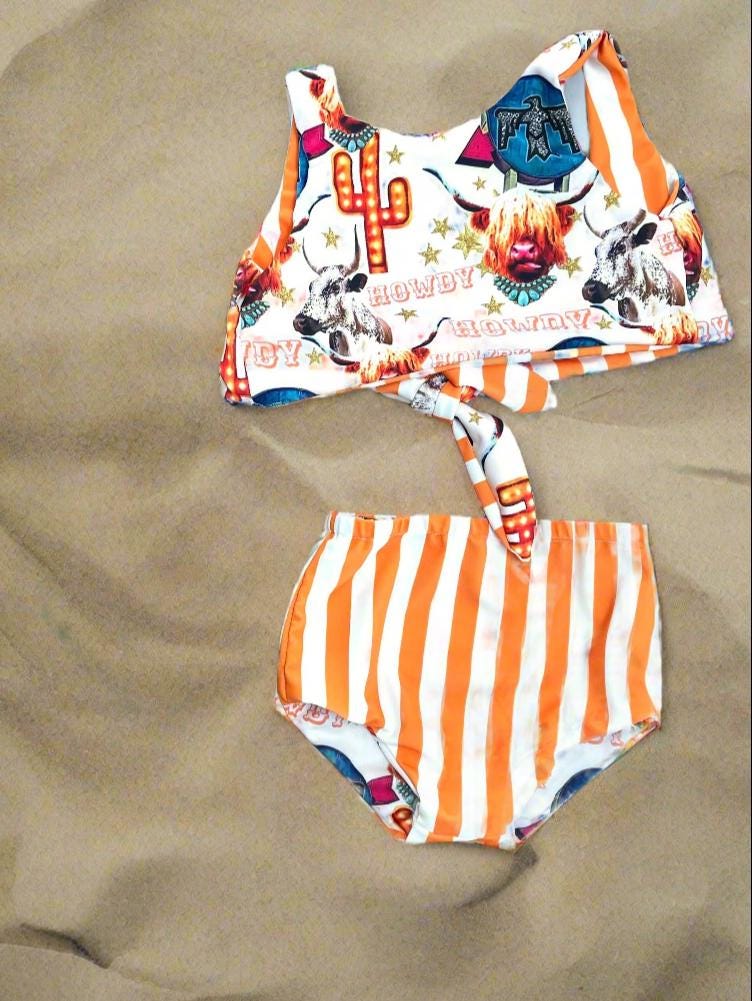 COW GIRL Swimsuit | Western Swimsuits | Striped Swimsuit | REVERSIBLE SWIMSUIT Highland Cow REVERSIBLE Swimsuit &Longhorn Cow Bikini This Western Reversible 2-piece Swimsuit is a must-have for summer fun! One side features the cutest cow-inspired fabric with Scottish Highland Cows, Longhorn Cows, Thunderbirds, and Neon Cactus Signs. Flip it over, and you&#39;ve got bright yellow stripes for a whole new look!  Reversible? Yes! Durable? Absolutely! Fun? 100%!  Available in sizes 0/3 months to 7/8.