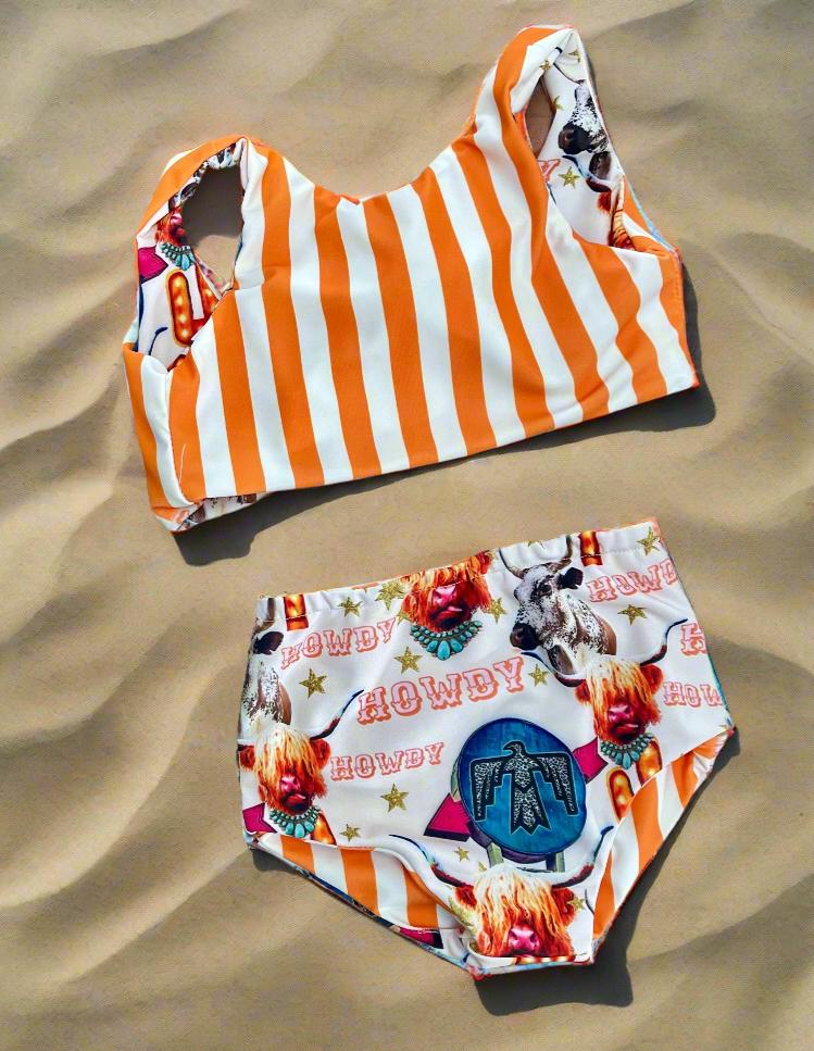 COW GIRL Swimsuit | Western Swimsuits | Striped Swimsuit | REVERSIBLE SWIMSUIT Highland Cow REVERSIBLE Swimsuit &Longhorn Cow Bikini This Western Reversible 2-piece Swimsuit is a must-have for summer fun! One side features the cutest cow-inspired fabric with Scottish Highland Cows, Longhorn Cows, Thunderbirds, and Neon Cactus Signs. Flip it over, and you&#39;ve got bright yellow stripes for a whole new look!  Reversible? Yes! Durable? Absolutely! Fun? 100%!  Available in sizes 0/3 months to 7/8.