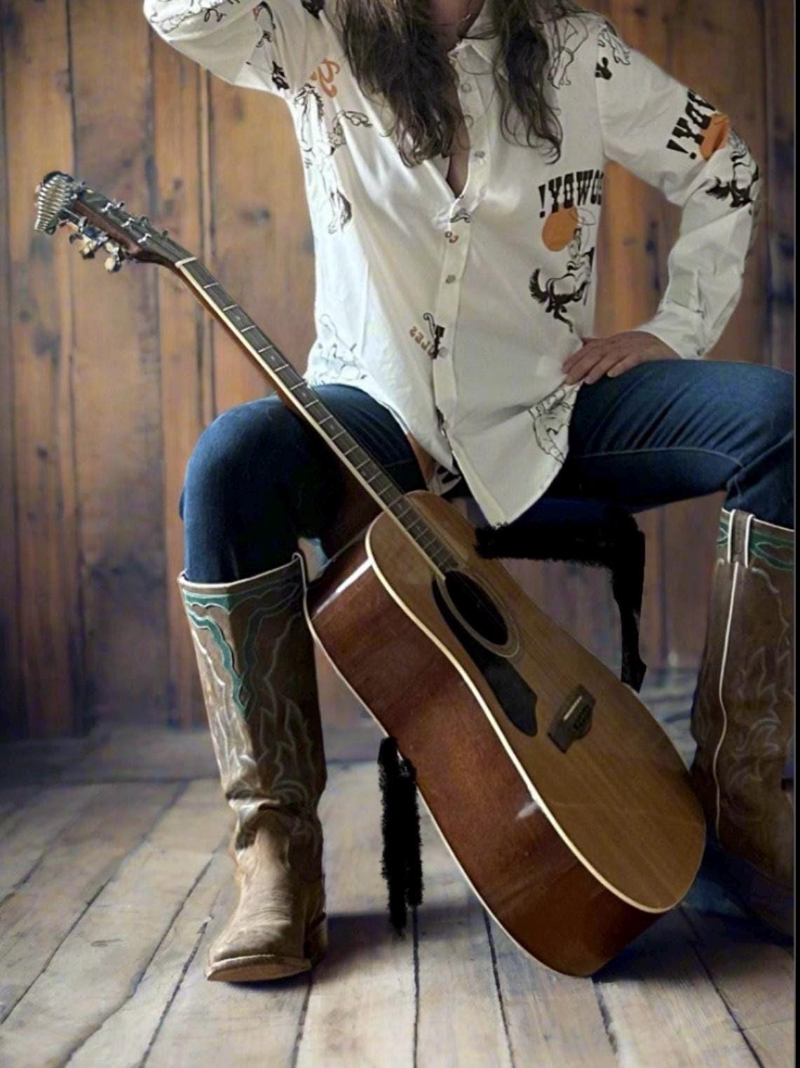 Women&#39;s Western Button-Up Shirt | Cowgirl Shirt with Retro Rodeo Vibes -This high-quality Western button-down shirt is a must-have for any cowgirl’s wardrobe! Made from 100% polyester, it offers a silky-soft feel, lightweight comfort, and all-day breathability—perfect for rodeos, nights out, or everyday Western wear.
✨ Why You’ll Love This Shirt:
✔️ Premium Fabric: Crafted from luxurious, high-quality polyester, this blouse is ultra-soft and smooth to the touch. SHIPS FREE from MONTANA toda