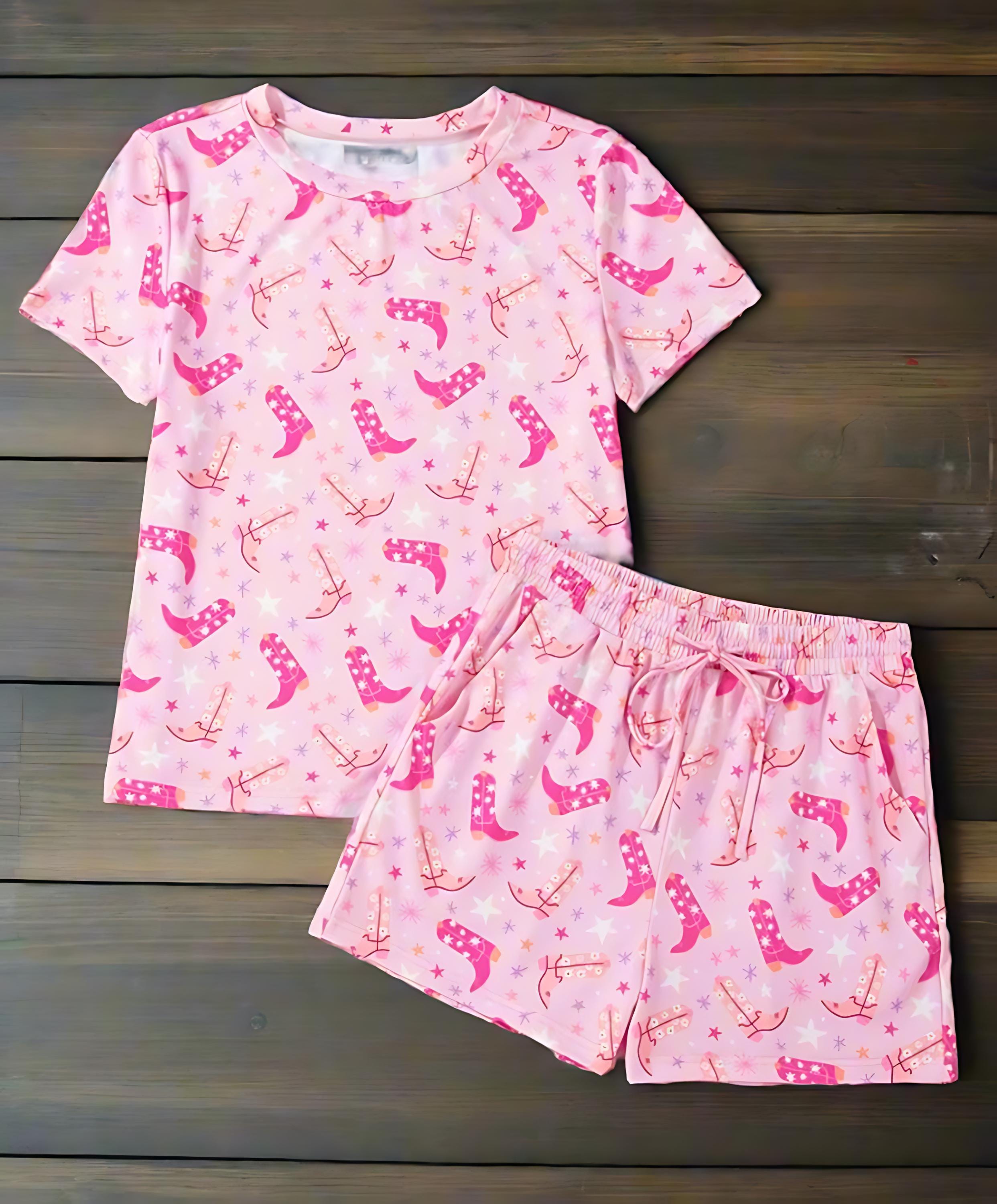 Pink Cowgirl Summer Pajamas | Western Lounge Set | Cowgirl Boot Pajamas
Cowgirl dreams meet summer comfort! This two-piece pajama set features an allover Western boots print in gorgeous shades of pink, orange, and white, accented by twinkling stars for the ultimate cowgirl vibe. Stylish, breathable, and oh-so-cozy!
✔ Two-Piece Set – Includes t-shirt-style top and matching shorts with pockets and a drawstring waist for the perfect fit.
✔ Soft & Breathable –