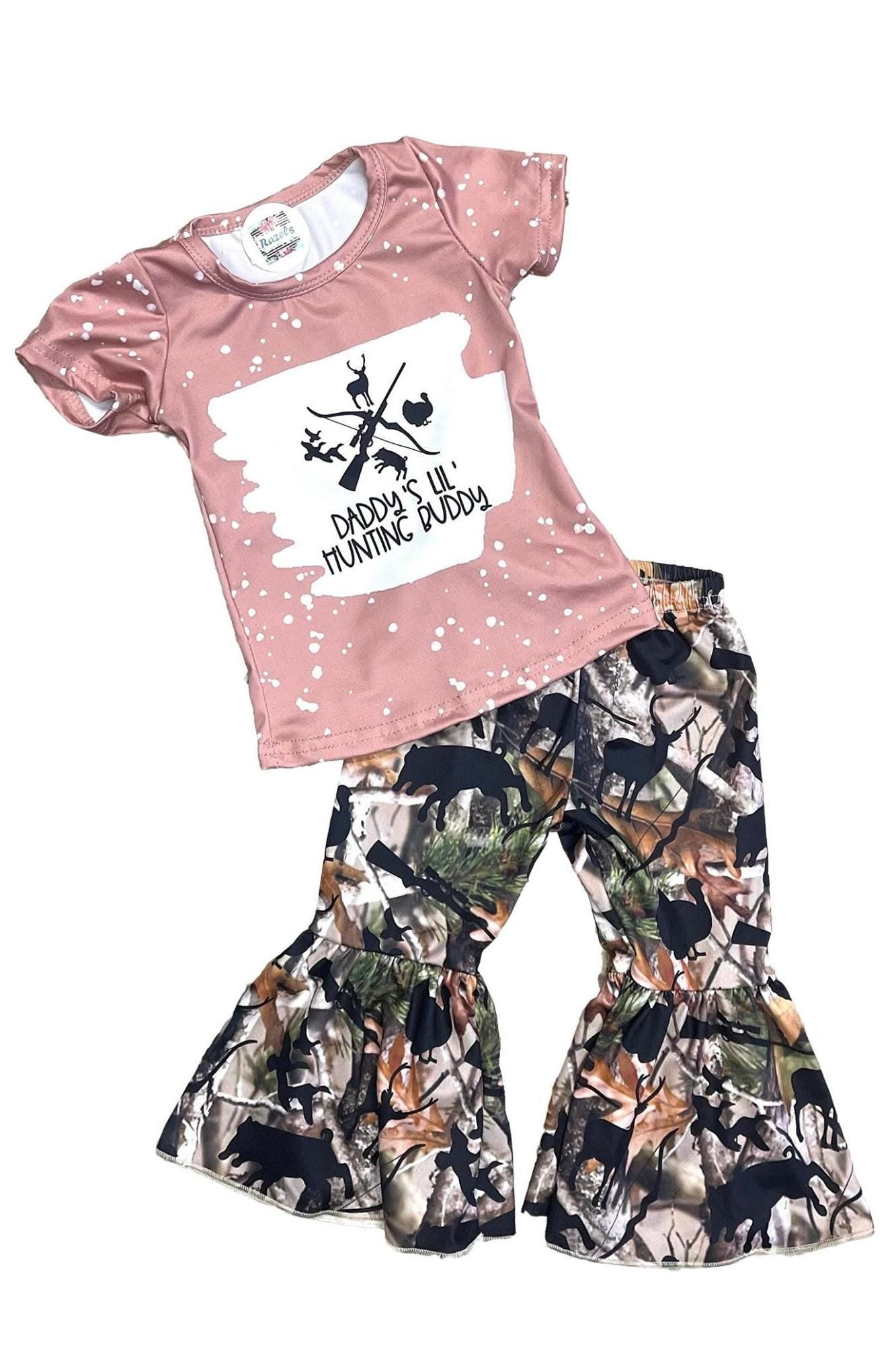 🎯 ONLY $10 — Size 7/8!  Hunting Season Steal! 🦌💕 Snag this adorable “Daddy’s Lil Hunting Buddy” Bell Bottom Outfit for just TEN bucks — yes, really!  This set is cuter than a deer in headlights 🦌 💖 Pink bleach-splattered tee with hunting graphics (deer, pig, turkey, rifle & bow) 🌿 Trendy camo bell bottoms with serious sass  🧼 Machine washable (mom win!) Perfect for your little hunting buddy to rock this season in Montana or anywhere the hunt is on!
