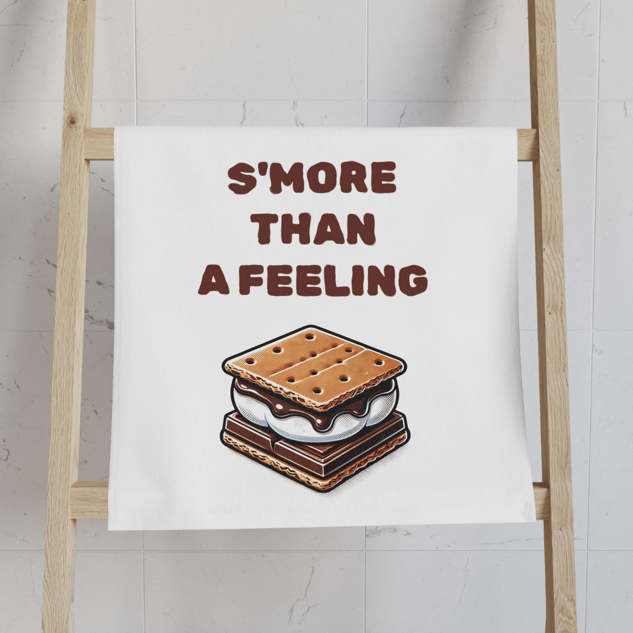 Funny S&#39;mores &quot;S&#39;more Than a Feeling&quot; Hand Towel 🏕️
✓ Playful “S’more Than a Feeling” design—perfect for camp lovers & pun fans
✓ Super soft & absorbent—great for drying hands or dishes
✓ Bright, vibrant colors that pop in any kitchen or camper
✓ Made from a durable 52% polyester / 48% cotton blend
✓ Generous size: 16&quot; × 28&quot; of marshmallowy magic
✓ Makes a cute gift for bakers, campers, or housewarmings