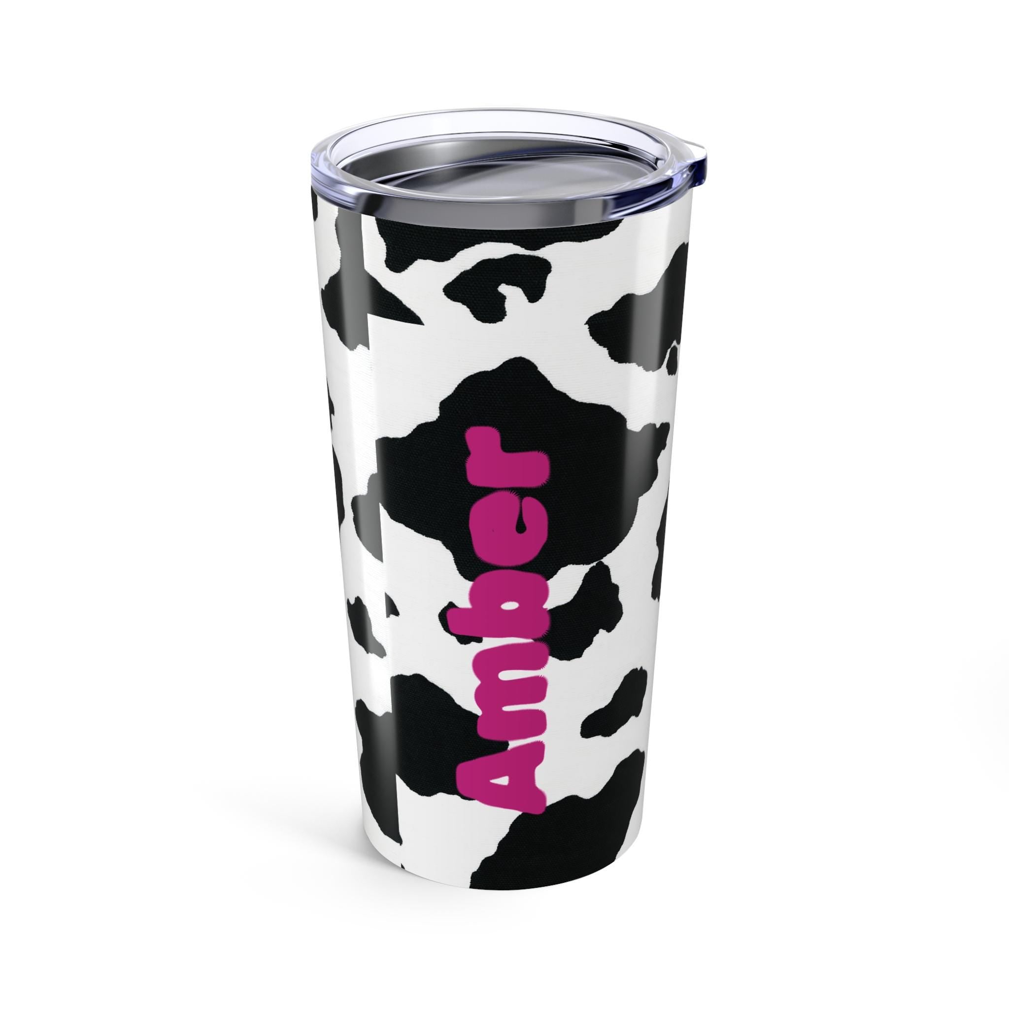 Moo-ve over boring drinkware—this tumbler is all about style + personality! 🌸 Our personalized cow print tumbler features your custom name wrapped in the cutest black-and-white pattern for a sassy, farmhouse-chic vibe. 
✓ Add your name for a custom touch that’s udderly adorable 🌿
✓ Double-walled stainless steel keeps drinks hot or cold for hours
✓ Glossy finish shows off the bold cow print in all its glory ✨

✓ Vacuum-insulated with clear push-on lid—perfect for life on the go ☕