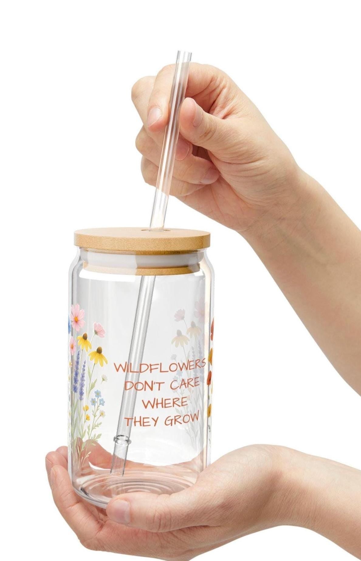 WILDFLOWERS DON&#39;T CARE WHERE THEY GROW—and now your drinkware can bloom just as freely. Whether you&#39;re enjoying iced coffee on the porch or lemonade in the sunshine, this floral glass adds a little joy to every sip.  Features you&#39;ll love: ✓ Custom name or phrase printed among the wildflowers ✓ 16 oz clear tempered glass with a vibrant floral design ✓ Optional bamboo lid + eco-friendly Tritan straw 🥤 ✓ BPA-free and proudly made in the USA ✓ Durable, reusable, and perfect for summer s