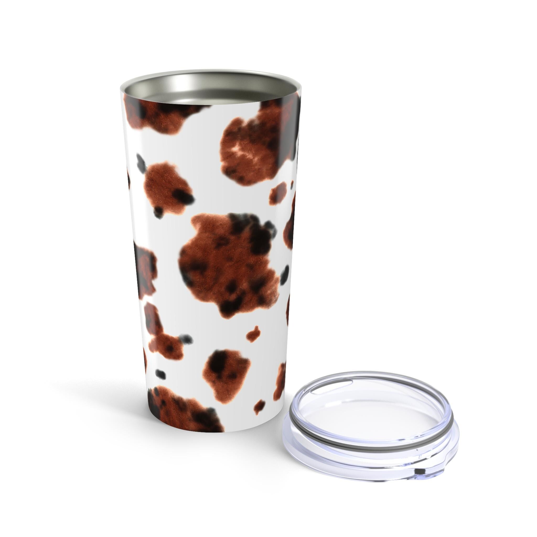 Our personalized cow print tumbler features your custom name wrapped in the cutest brown brindle pattern.  this 20oz stainless steel tumbler has you covered—literally—with a secure, vacuum-insulated lid. 🌼

✓ Add your name for a custom touch that’s udderly adorable 🌿
✓ Double-walled stainless steel keeps drinks hot or cold for hours
✓ Glossy finish shows off the bold cow print in all its glory ✨
✓ Vacuum-insulated with clear push-on lid—perfect for life on the go ☕