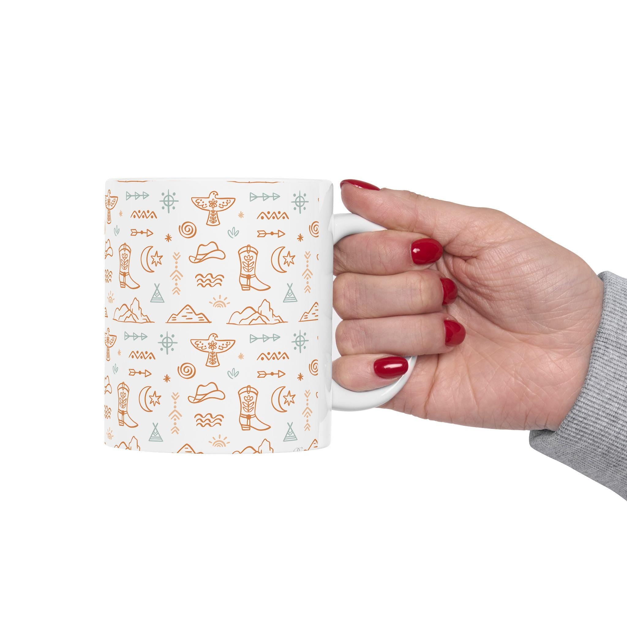 Western Motif Cowgirl Ceramic Mug 🤠 (11oz or 15oz) – Beige & Turquoise Boots, Stars & Thunderbirds

Start your day with big Western energy 🌄☕ This vibrant ceramic mug features an allover print of boots, cowgirl hats, stars, mountains, and thunderbirds in warm beige and turquoise tones—a cozy combo that captures the spirit of the open range.

Whether you&#39;re sipping coffee at sunrise or winding down with tea by the fire, this mug brings rustic charm and a stylish flair to your daily rituals