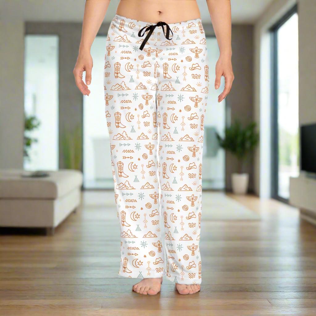 Slip into something fun and comfy with these standout Western pajama pants! Featuring an allover print of boots, mountains, stars, thunderbirds, and cowgirl hats, it’s got big Western energy in the best way. 
✅ 100% polyester jersey knit for ultimate comfort
✅ Relaxed fit with back elastic and black drawstring tie
✅ Fun and vibrant all-over print design
✅ Light fabric with white seam thread
✅ Sewn-in care label
✅ Made to order: production 3 days, shipping 2–5 days
✅ FREE shipping on order