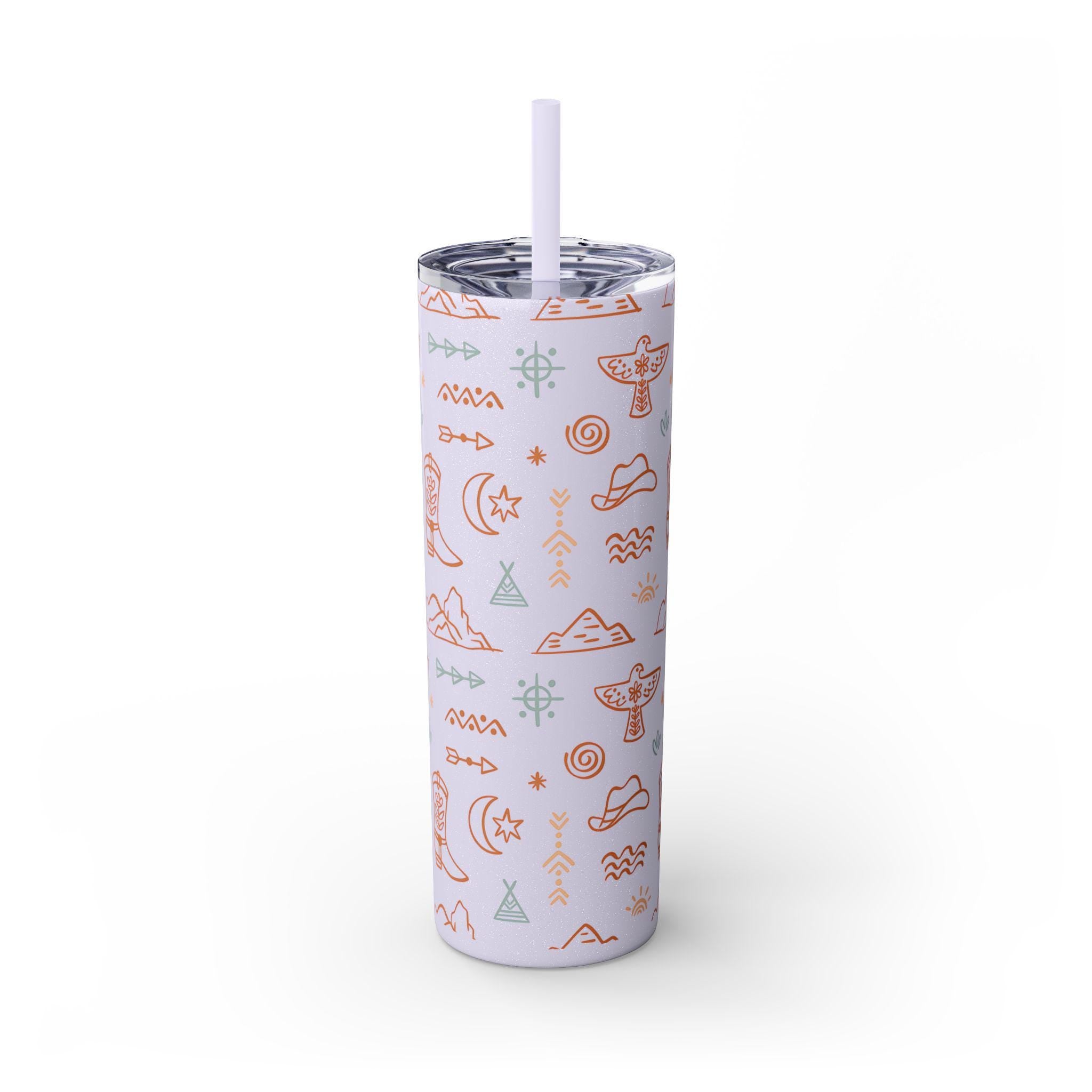WESTERN SKINNY TUMBLER, COWBOY TUMBLER, COWGIRL TUMBLER FEATURING: allover boho western print featuring thunderbirds, mountains, cowboy hats, boots, and other iconic Western symbols. Double-wall insulation  Available in 8 stunning colors, including glitter options  Includes a clear plastic lid with a color-matching straw ✅ Made from durable, non-toxic stainless steel and BPA-free plastic. ✅ Slim, tapered design fit SHIPS FREE W/ $35+ PURCHASE