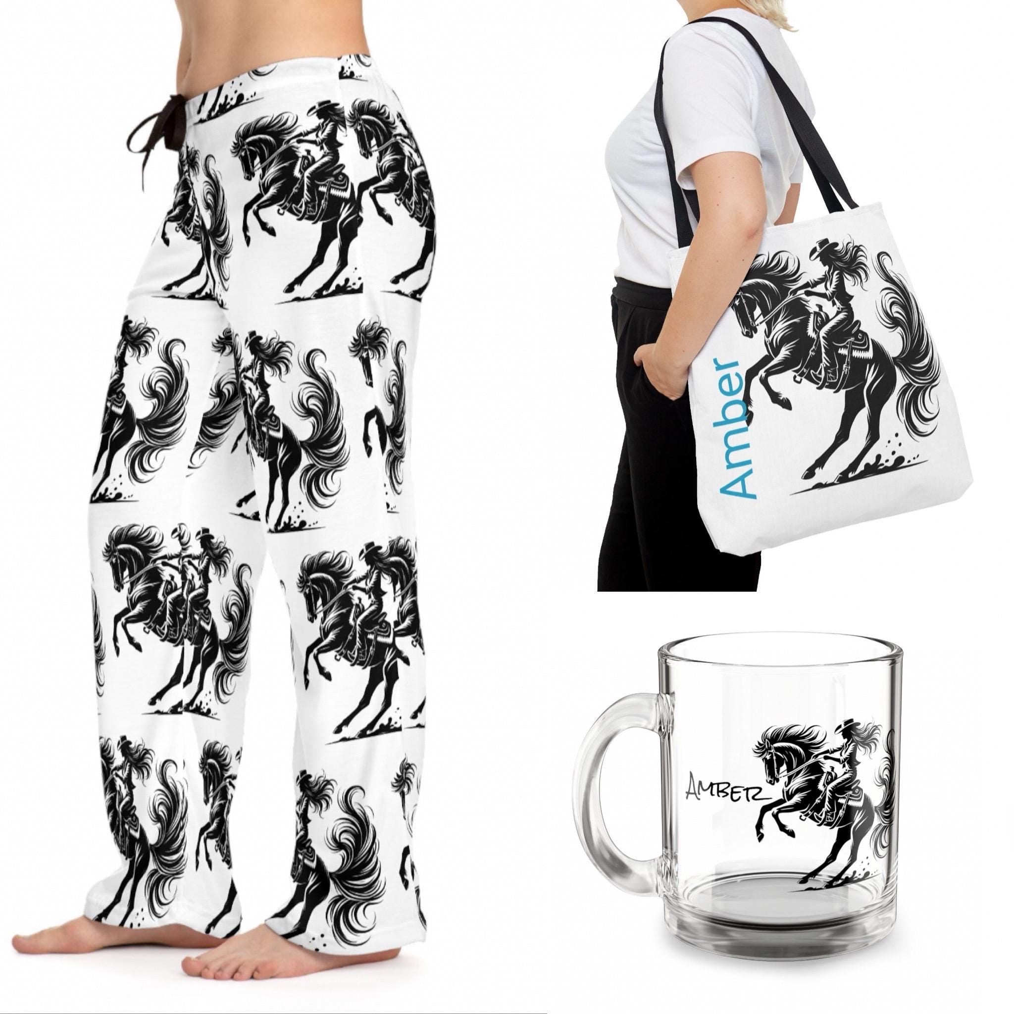 Wild Cowgirl Pajama Pants – Bold Western Lounge Vibes
Perfect for bachelorette parties, horse lovers, or any cowgirl who rides bold—even in her dreams. Wear them as pajamas, loungewear, or throw on a hoodie and boots.
100% polyester jersey knit – soft, lightweight, and made to move
Relaxed comfort fit with a flowy silhouette
✅ Bold all-over cowgirl & horse print – black on crisp white
 Back elastic waistband + black drawstring for a custom fit
 Tagless comfort with a sewn-in care label