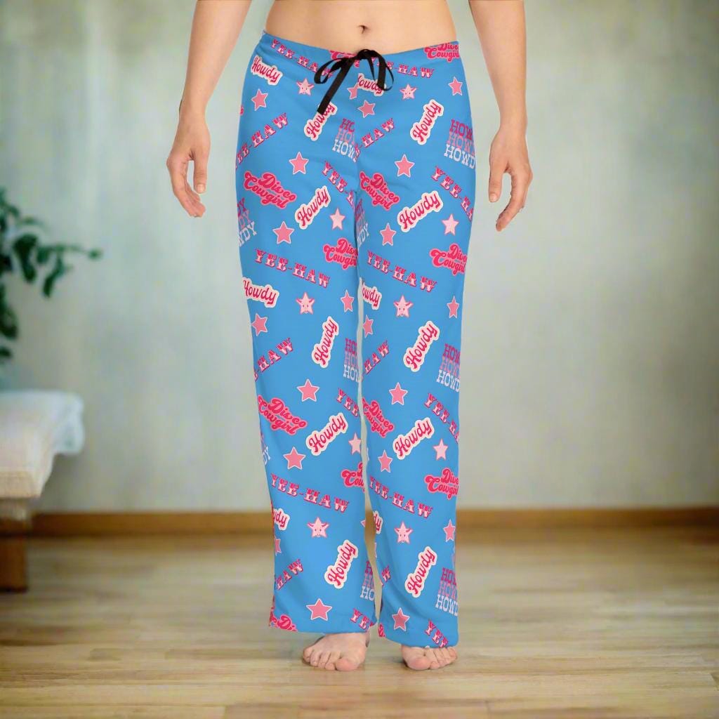 Disco Cowgirl Pajama Pants – Periwinkle Yeehaw Dreams 💫🤠
Bring the party to your pajamas! These periwinkle blue lounge pants are covered in playful phrases like &quot;Disco Cowgirl,&quot; &quot;Howdy,&quot; &quot;Yee Haw,&quot; and sprinkled with stars for that extra Western sparkle. Whether you&#39;re chilling at home or planning the cutest cowgirl-themed sleepover, these fun PJs bring bold cowgirl energy to every moment.