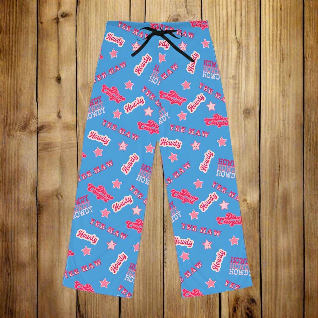 Disco Cowgirl Pajama Pants – Periwinkle Yeehaw Dreams 💫🤠

✅ Soft, lightweight 100% polyester jersey knit
✅ Relaxed, flowy fit that moves with you
✅ Fun all-over print in vibrant periwinkle + bold Western phrases
✅ Elastic waistband with black drawstring for the perfect fit
✅ Tagless and comfy with a sewn-in care label
✅ Made to order in 3 days, ships in 2–5 days