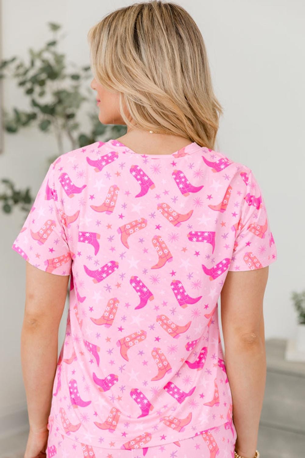 🌵 Cowgirl dreams meet summer comfort! This two-piece pajama set features an allover Western boots print in gorgeous shades of pink, orange, and white, accented by twinkling stars for the ultimate cowgirl vibe. Stylish, breathable, and oh-so-cozy!

💖 Why You&#39;ll Love It:
✔ Two-Piece Set – Includes t-shirt-style top and matching shorts with pockets and a drawstring waist for the perfect fit.
✔ Soft & Breathable – Lightweight fabric keeps you cool and comfy for lounging or sleeping.