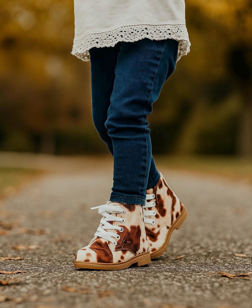 Cow Print Boots for Toddlers 🤎🤍 Yeehaw! These adorable cowprint boots are the ultimate statement piece for your little cowgirl or cowboy. Whether you&#39;re headed to the rodeo, school, or the playground, these toddler Western boots add a whole lot of charm to every step!  ✔️ Fun & stylish brown cow print ✔️ Side zippers for easy on & off ✔️ Durable rubber sole + comfy cotton/leather blend ✔️ Perfect for dressing up or down ✔️ Great for rodeos, family photos, fall fairs & more!