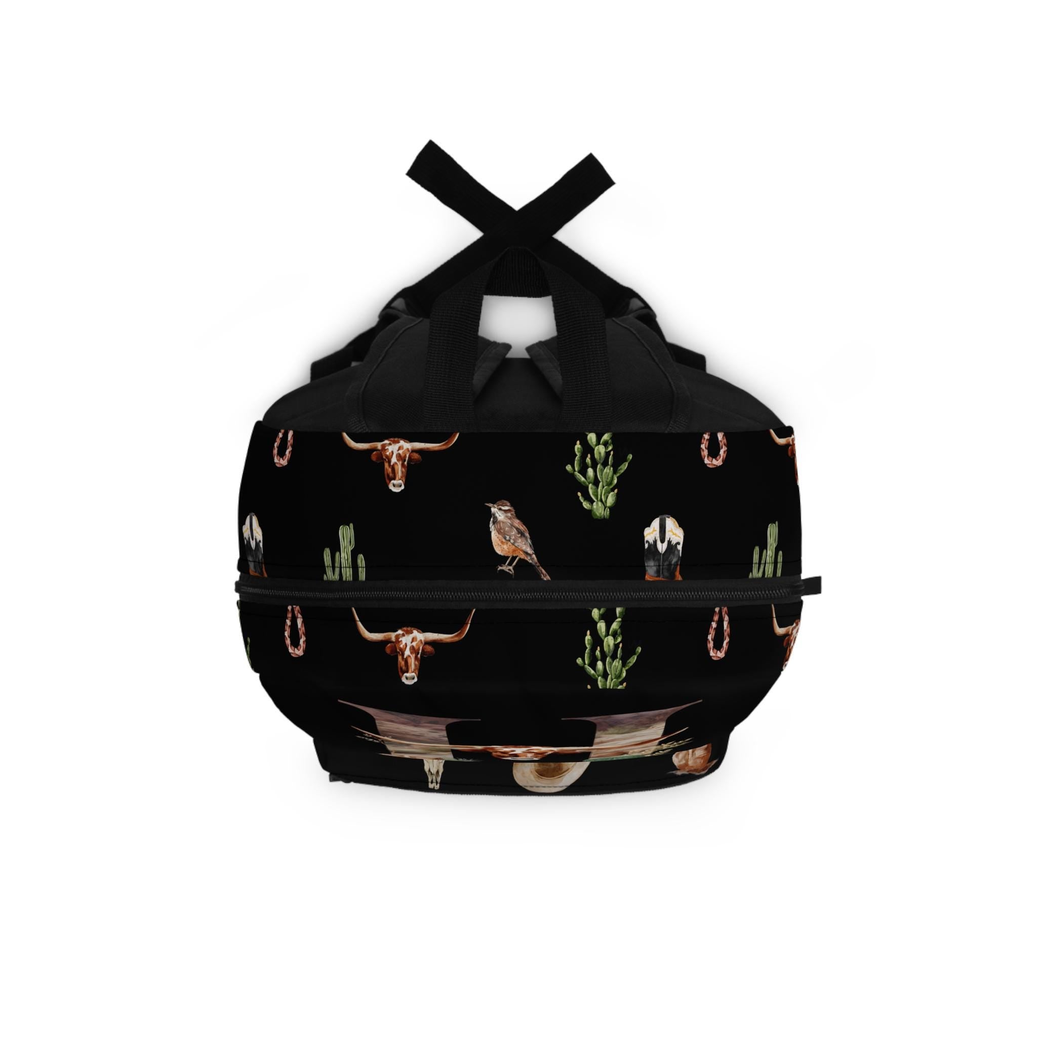 This is not your average backpack—it’s the COOLEST cowboy backpack ever. Jet black and decked out in boots, skulls, snakes, horses, longhorns, hats, and cacti... with your initial front and center in bold Western style! 💥

✓ Allover Western motif – boots, skulls, snakes, horses & more
✓ Bold personalized initial right up front
✓ 100% durable polyester – lightweight & quick-drying
✓ Padded back panel & straps for comfy carry
✓ 4 spacious compartments for easy organization