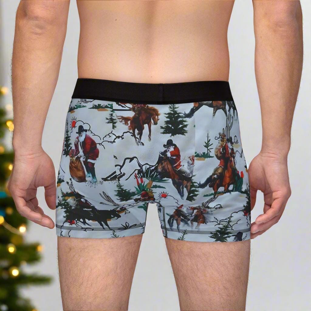 Saddle up for some serious holiday cheer! These Men’s Cowboy Santa Boxers are bringing the Christmas spirit with a bold Western twist. Featuring Cowboy Santa riding horseback (with a wild bronc or two in the mix), these festive undies are perfect for Christmas morning laughs, cozy nights in, or just spicing up your everyday basics. 
✓ 92% polyester for durability and fast drying
✓ Soft elastic waistband for all-day comfort
✓ Bright, vibrant allover Cowboy Santa print
FREE SHIPPING $35+