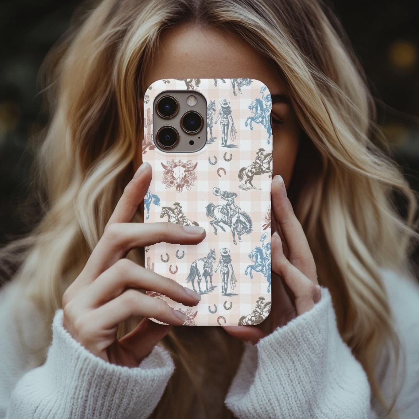 Western Cowgirl Phone Case, featuring bold cowgirls riding broncs, rearing horses, and walking alongside their trusty steeds—all set against a stylish peach plaid background. Accented with skulls, 
✓ Full-wrap western design – glossy or matte finish
✓ Shock-absorbing dual-layer build with silicone liner
✓ Drop protection with tough polycarbonate shell
✓ UV-protected imagery for long-lasting color
✓ Compatible with iPhone 11–15, SE and Samsung Galaxy S21–S24 (message us for others)