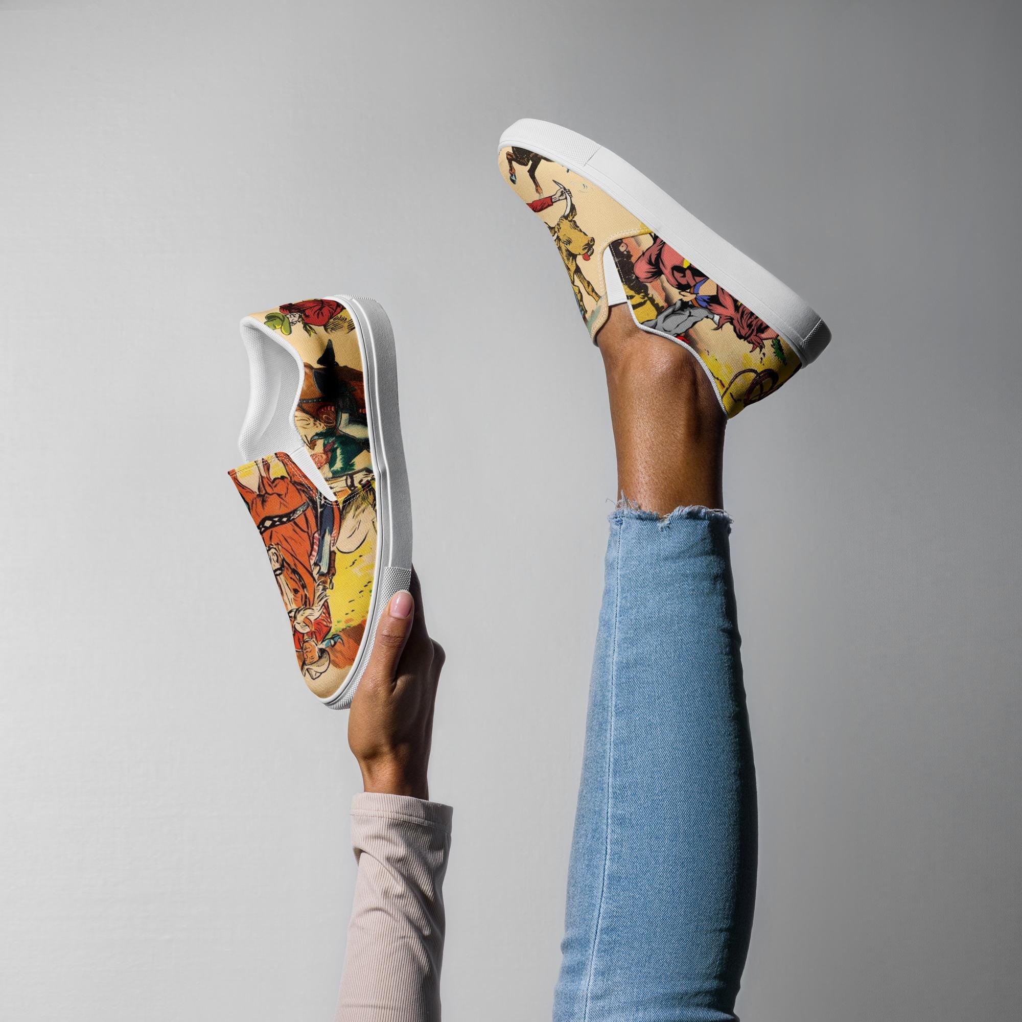Vintage Cowgirl Slip-On Sneakers – Western Style Made Easy 🤠
ships FREE
✓ Allover retro rodeo print with cowboys, bulls, and broncs
✓ Easy slip-on design with elastic sides for the perfect fit
✓ Soft, removable insole and breathable lining = all-day comfort
✓ Cushioned collar and tongue for extra cozy wear
✓ Durable EVA rubber outsole handles whatever the day brings
✓ Printed, cut, and handmade with attention to every stitch