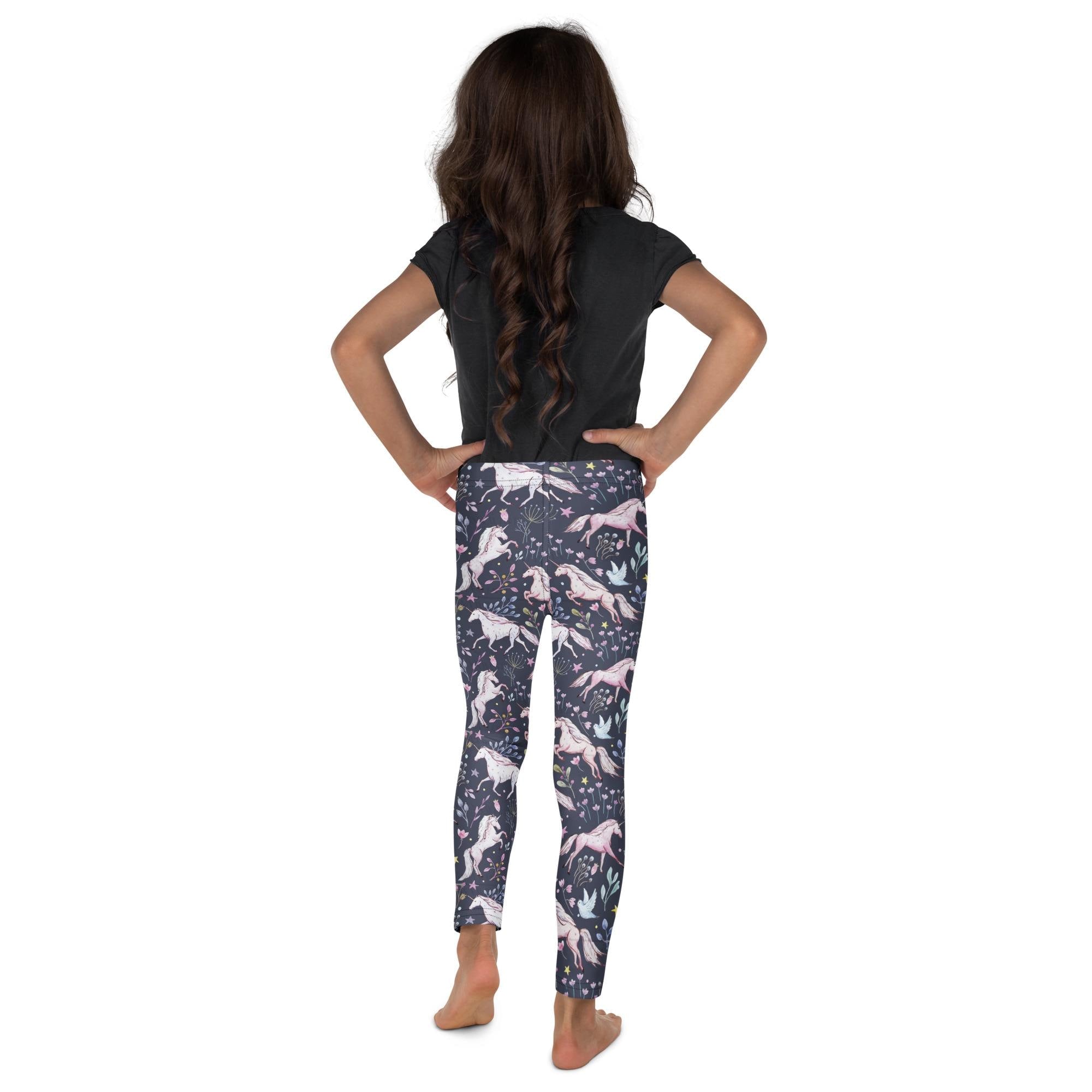 Give her back-to-school wardrobe a magical upgrade! These navy leggings are sprinkled with dreamy unicorns and delicate flowers, With their buttery-soft feel and stay-put waistband, they’re built for play and pretty.

✓ All-over unicorn + floral print she’ll love
✓ Super stretchy + comfy microfiber yarn
✓ Vibrant colors that won’t fade
✓ Elastic waistband = easy on/off
✓ Precision-cut + hand-sewn for a polished finish