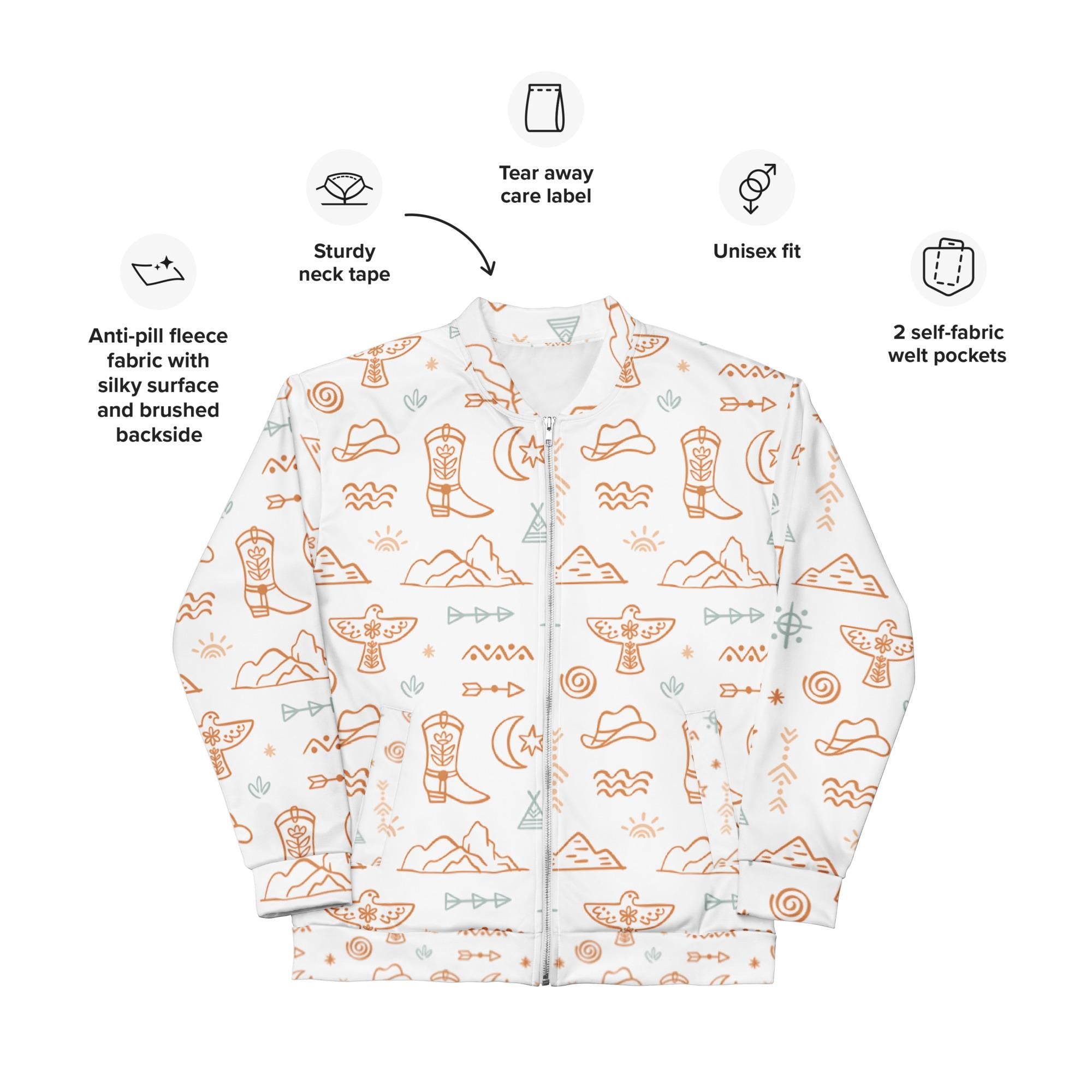 Beige & White Western Motif Bomber Jacket | Fall Cowgirl Style 🤠
Saddle up for cooler days in this bold and cozy Cowboy-themed jacket! Featuring a dreamy blend of classic Western elements—cowboys, cacti, sunbursts, thunderbirds, and steer heads—this all-over print bomber is a perfect statement piece for fall.

✓ Cozy brushed fleece interior
✓ Unisex relaxed fit—perfect for layering

✓ Two roomy self-fabric pockets
✓ All-over Western print in soft beige & white tones