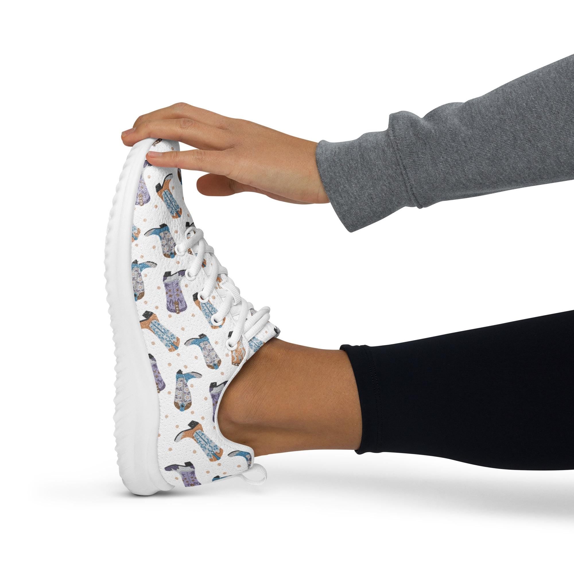 Cowboy Boot Athletic Sneakers | Lightweight Western Lace-Up Shoes 
Put a little giddy-up in your step! These lightweight athletic sneakers are covered in a fun and funky cowboy boot print in grey, purple, and turquoise—bringing Western charm to your everyday hustle. Whether you&#39;re on your feet all day or running errands around town, 
✓ All-over cowboy boot print in grey, purple & turquoise
✓ Lace-up front for a secure fit
✓ Matching colored soles & laces
FREE SHIPPING