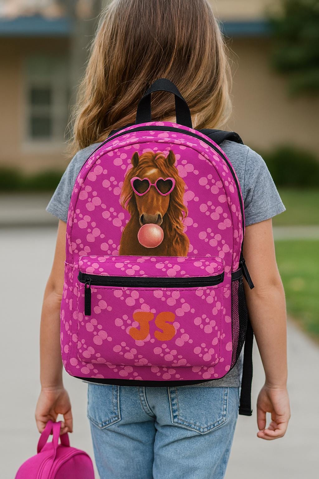 Custom Horse Backpack featuring a stylish horse rocking heart-shaped sunglasses and blowing a big pink bubble! Perfect for girls who love horses and bold, fun fashion, this backpack is sure to be a head-turner in the hallways. 🎒✨

✓ Vibrant pink bubble pattern with fun horse graphic
✓ Personalized front pocket with initials or name
✓ Spacious main compartment for books, tablets & more
✓ Front zip pocket & side mesh pockets for quick-grab items
✓ FREE Shipping within the USA!