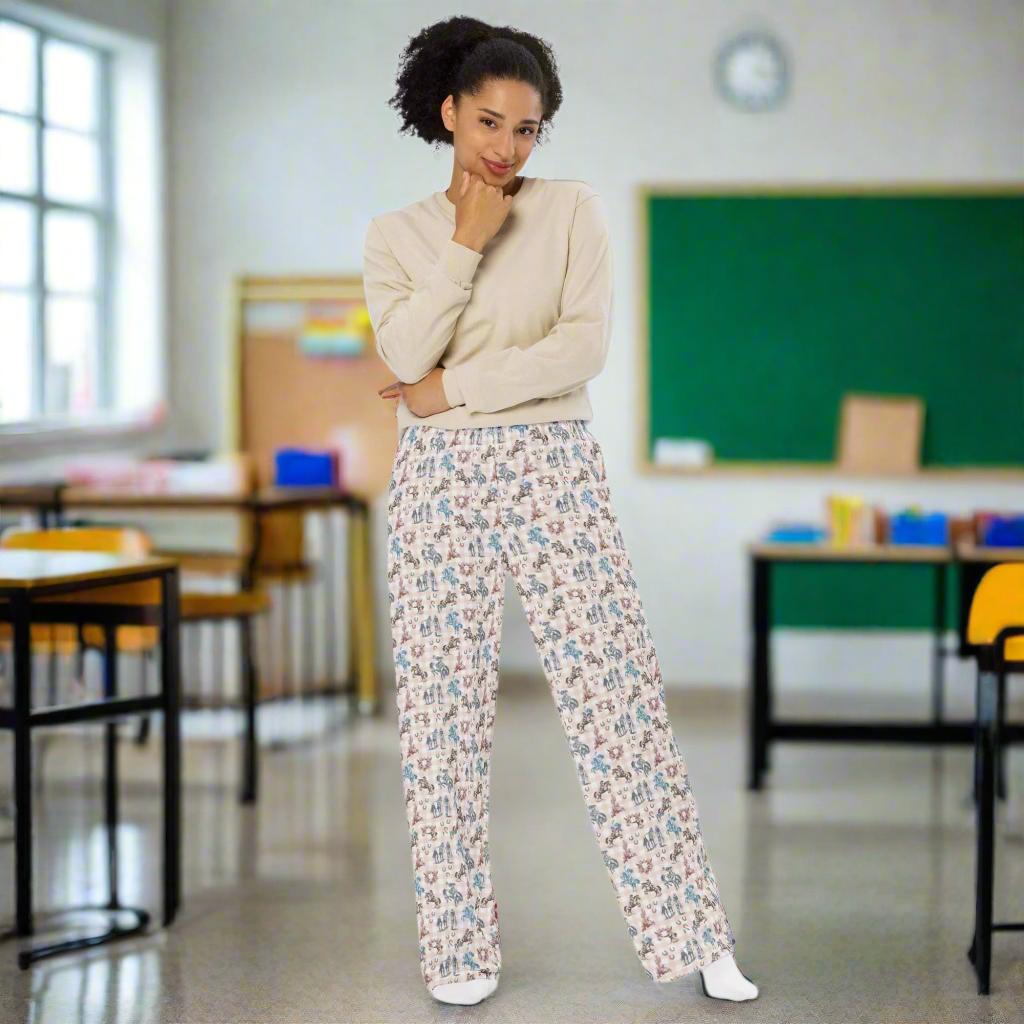 All-Over Print Cowgirl Wide-Leg Pants | Retro Western Unisex Lounge Pants 
Saddle up in style with these all-over print wide-leg pants, covered in bold retro cowgirl art! Featuring cowgirls riding broncs, rearing horses, and strolling alongside their trusty steeds, this design captures the true spirit of the Wild West. Set against a dusty blue and peach plaid backdrop, with classic cowboy icons like skulls, cacti, and horseshoes, these pants are a Western standout.
✓ Relaxed unisex fit