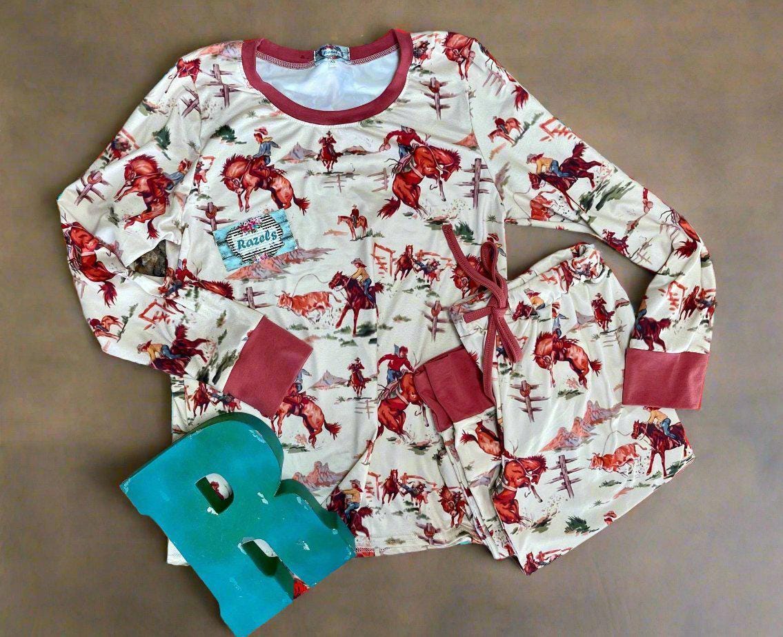 Retro Western Vintage Cowboy Pajamas: Bring the rodeo home with these Classic Western Pajamas from Razels! Featuring a vintage cowboy print with bucking broncs, roping steers, and steer wrestling. Available in baby 3/6 months - adult 4x! Ships FREE.