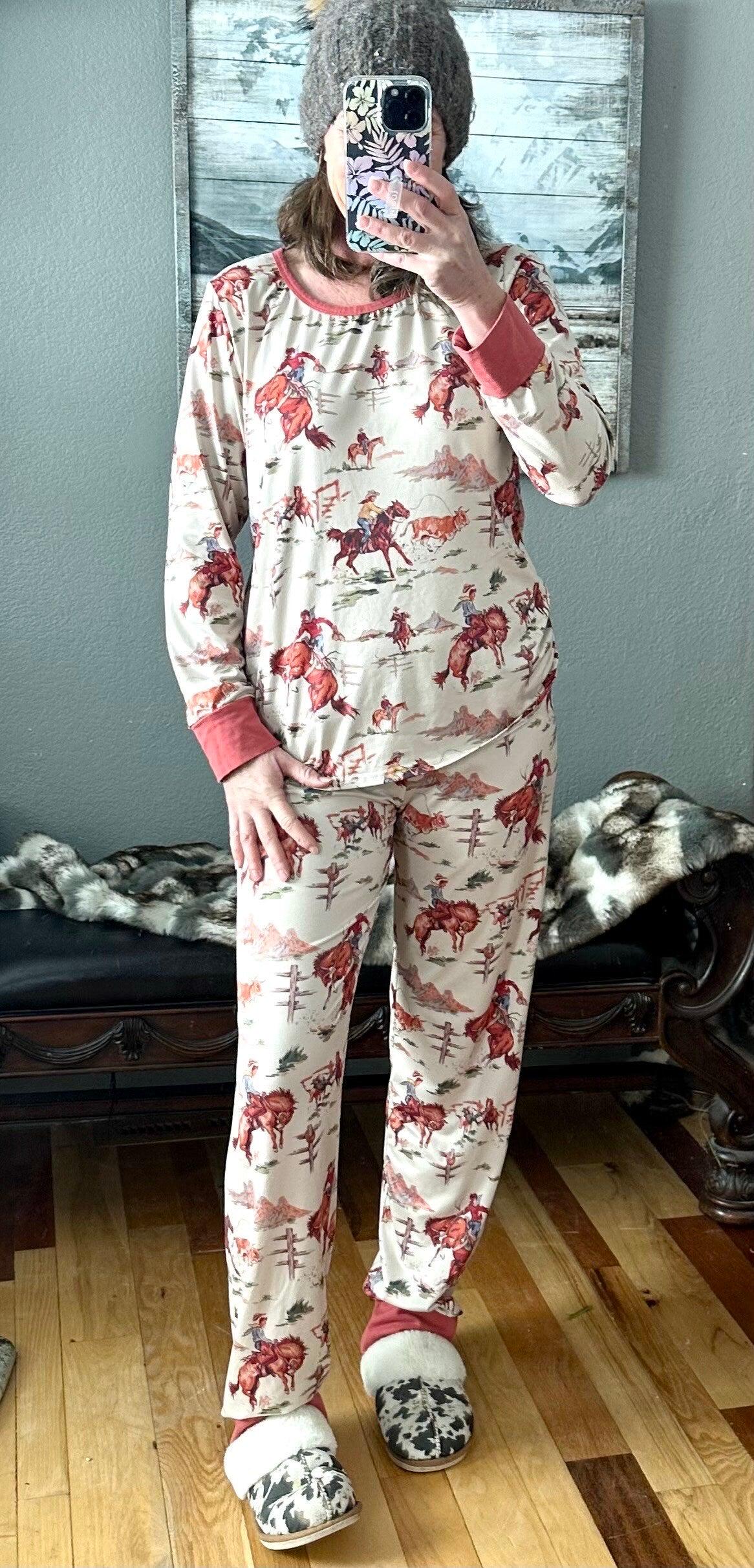 Retro Western Vintage Cowboy Pajamas: Bring the rodeo home with these Classic Western Pajamas from Razels! Featuring a vintage cowboy print with bucking broncs, roping steers, and steer wrestling. Available in baby 3/6 months - adult 4x! Ships FREE.