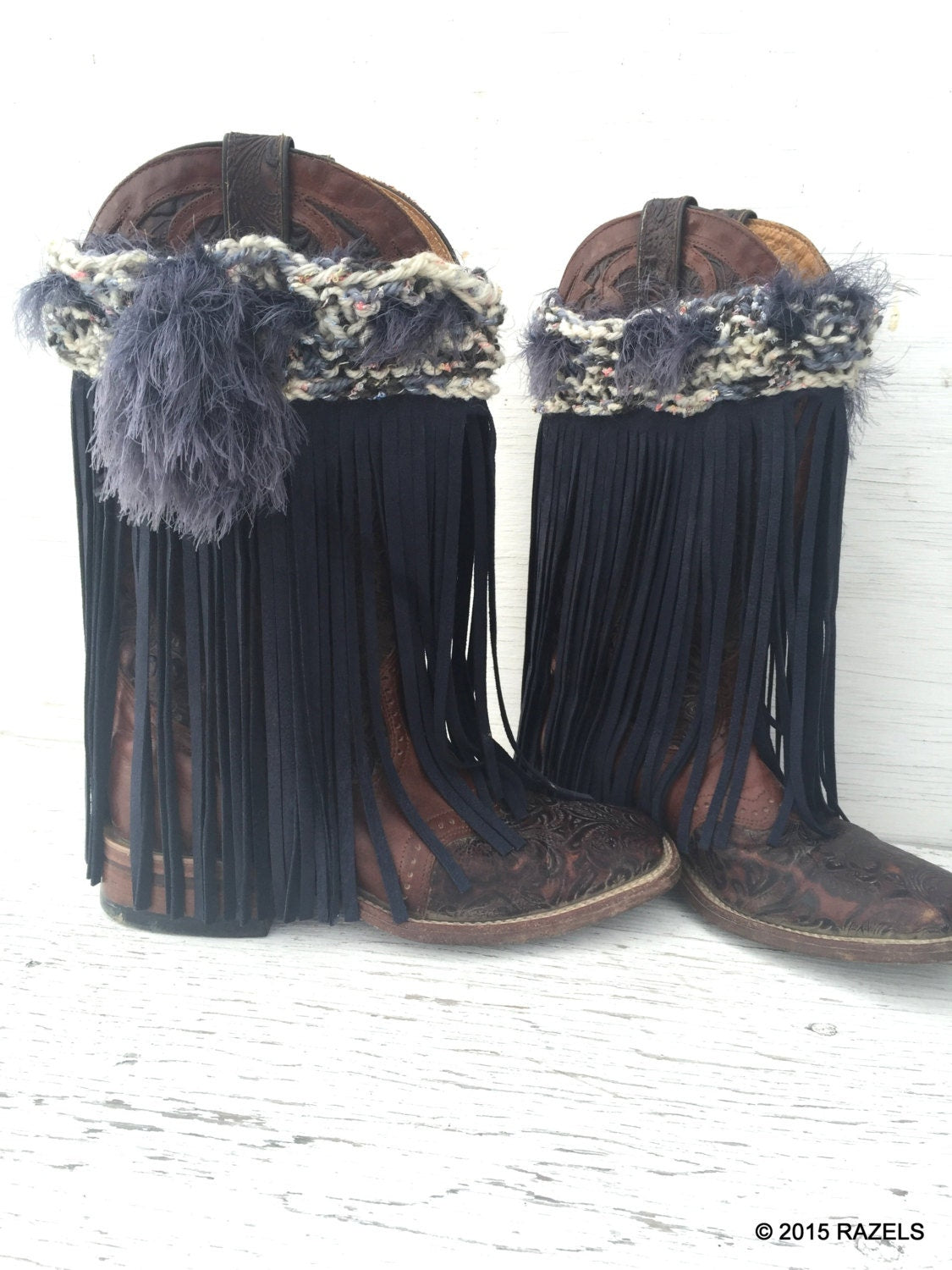 ✨ ONE-OF-A-KIND! ONLY PAIR MADE! ✨

🔥 CLOSEOUT PRICE: $25 + FREE SHIPPING! 🔥

Turn heads with these festival-fabulous Leather Fringe Boot Covers! Hand-knit, hand-fringed, and totally unique, they’re the perfect statement piece for festivals, western wear, or everyday boho vibes.

💙 Features:
✔ Hand-knit top in a dreamy mix of cream, blue, grey & black, with hints of pastel that look like tiny flowers! 🌸
✔ Dark blue leather fringe fo
✔ Hand-knit ‘fur’ boa drawstring 
✔ Adjustable fit t