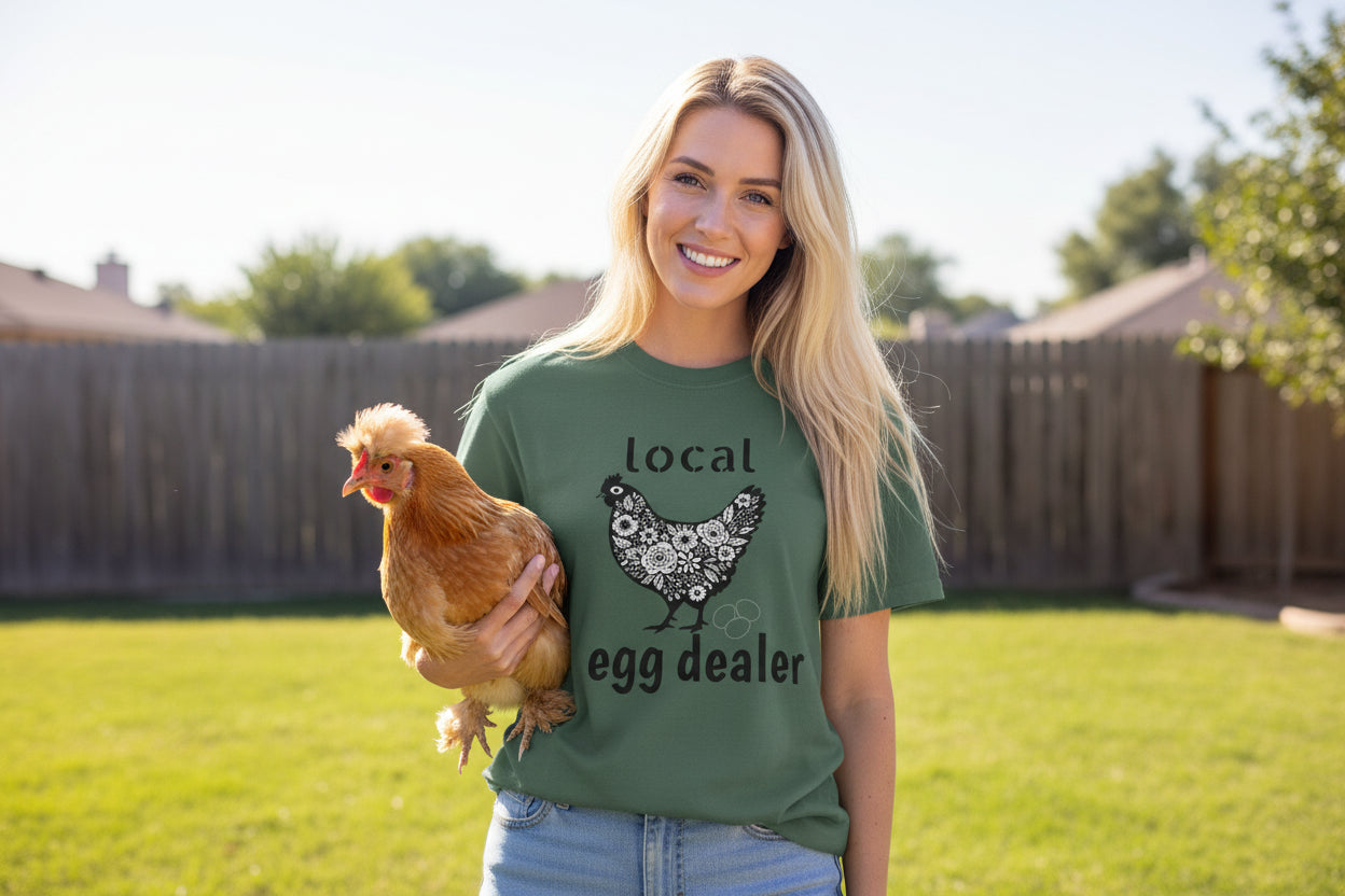 Woman wearing a green t-shirt with a chicken graphic and text on a white background
