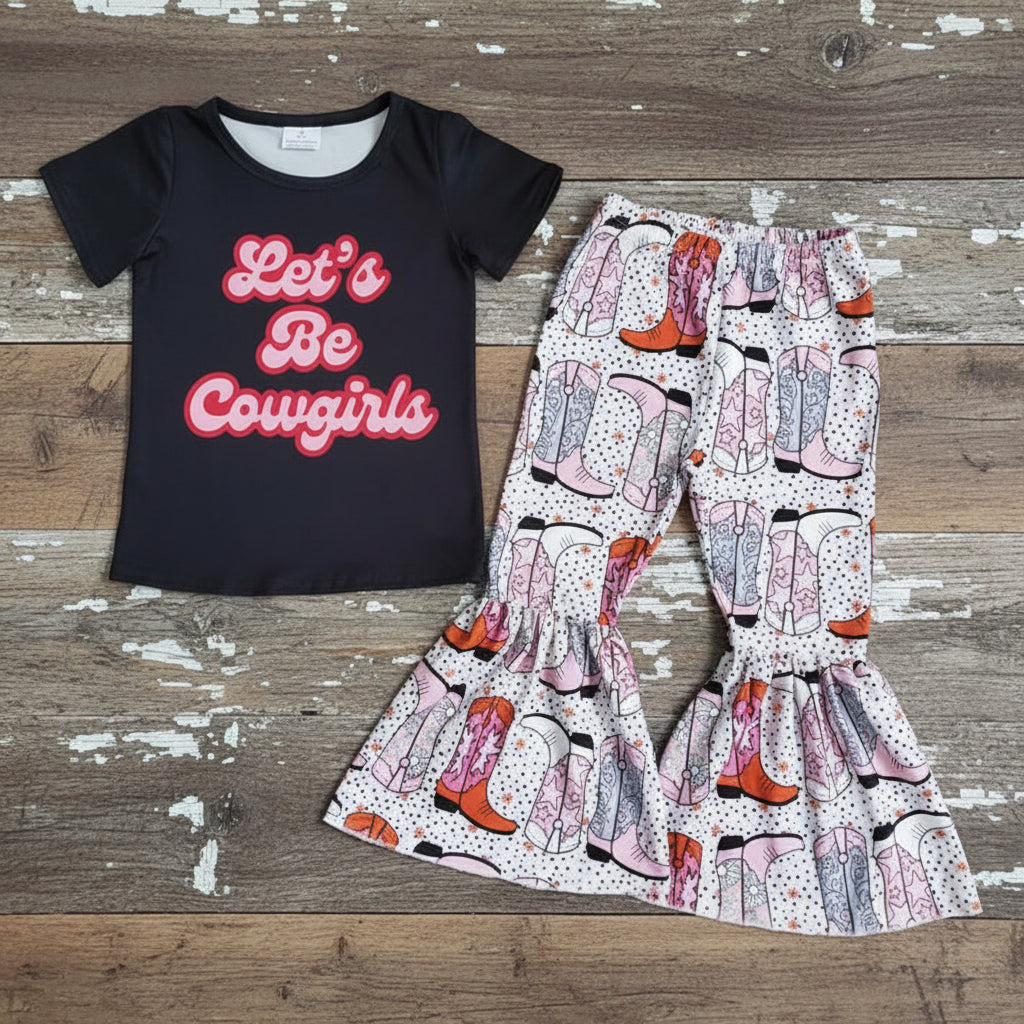 girls bell bottom outfit featuring a Black t-shirt with 'Let's Be Cowgirls' text and patterned pants with cowboy boot design on a textured surface.