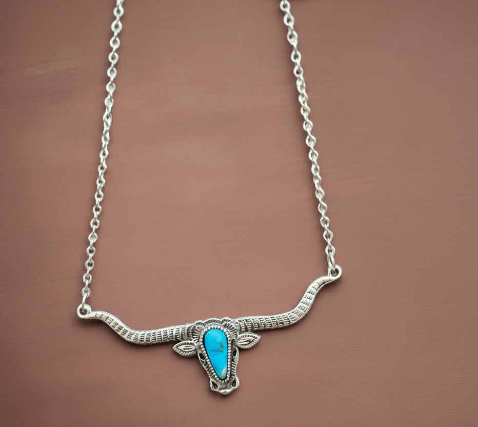 Bold and Beautiful: Split Chain Longhorn Necklace with Turquoise Stone. Embrace a bold, Western style with our stunning Split Chain Longhorn Necklace—designed for those who truly & grab life by the horns. Ships FREE with $35+ purchase