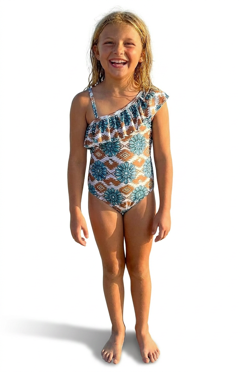 Young girl wearing a Cowgirl Swimsuit, Turquoise Conchos, Western Swimsuits, SOUTHWESTERN, Squash blossoms, patterned one-piece swimsuit on a white background