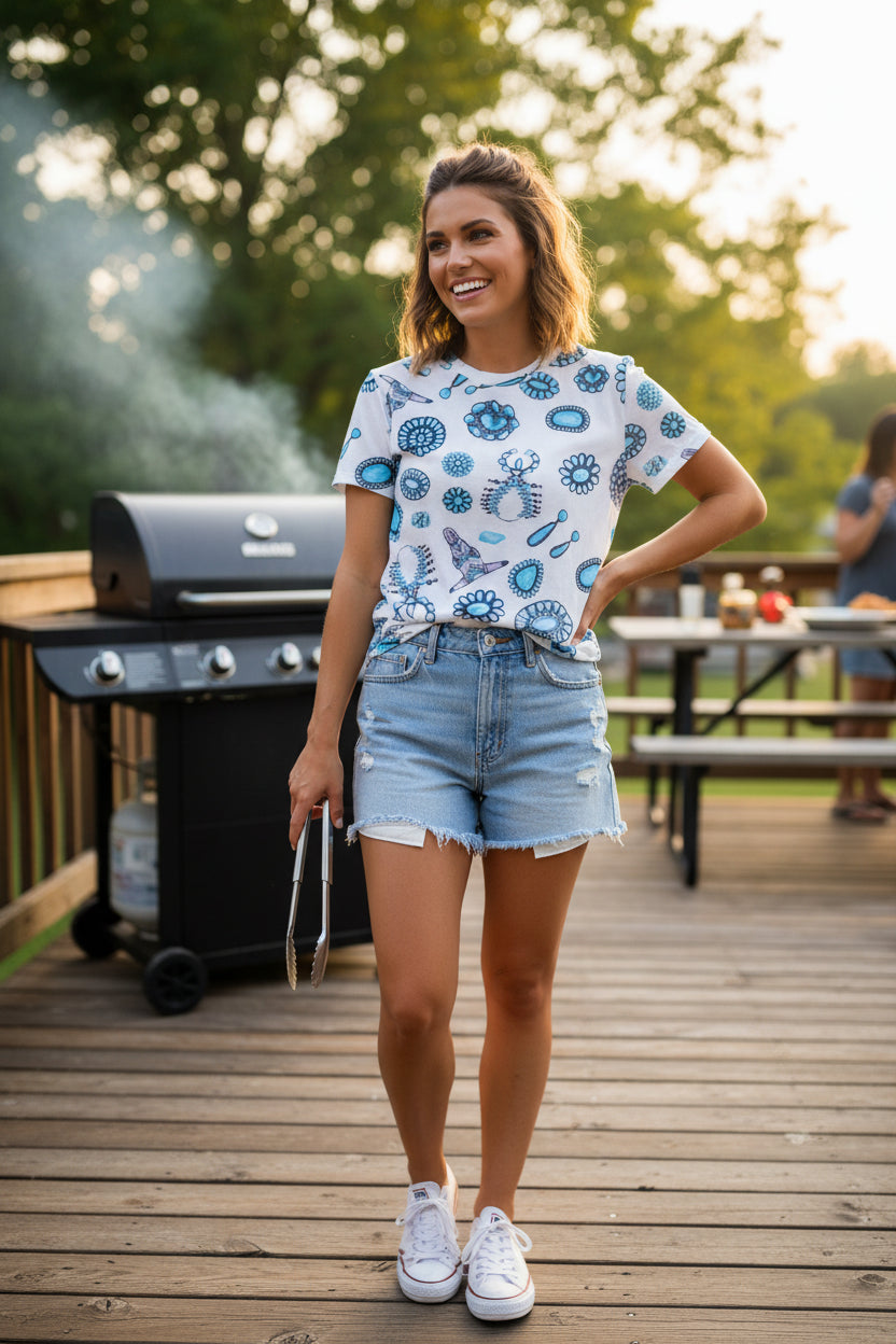 woman wearing razels womens mesh top , western white and turquoise tshirt whiile bbq