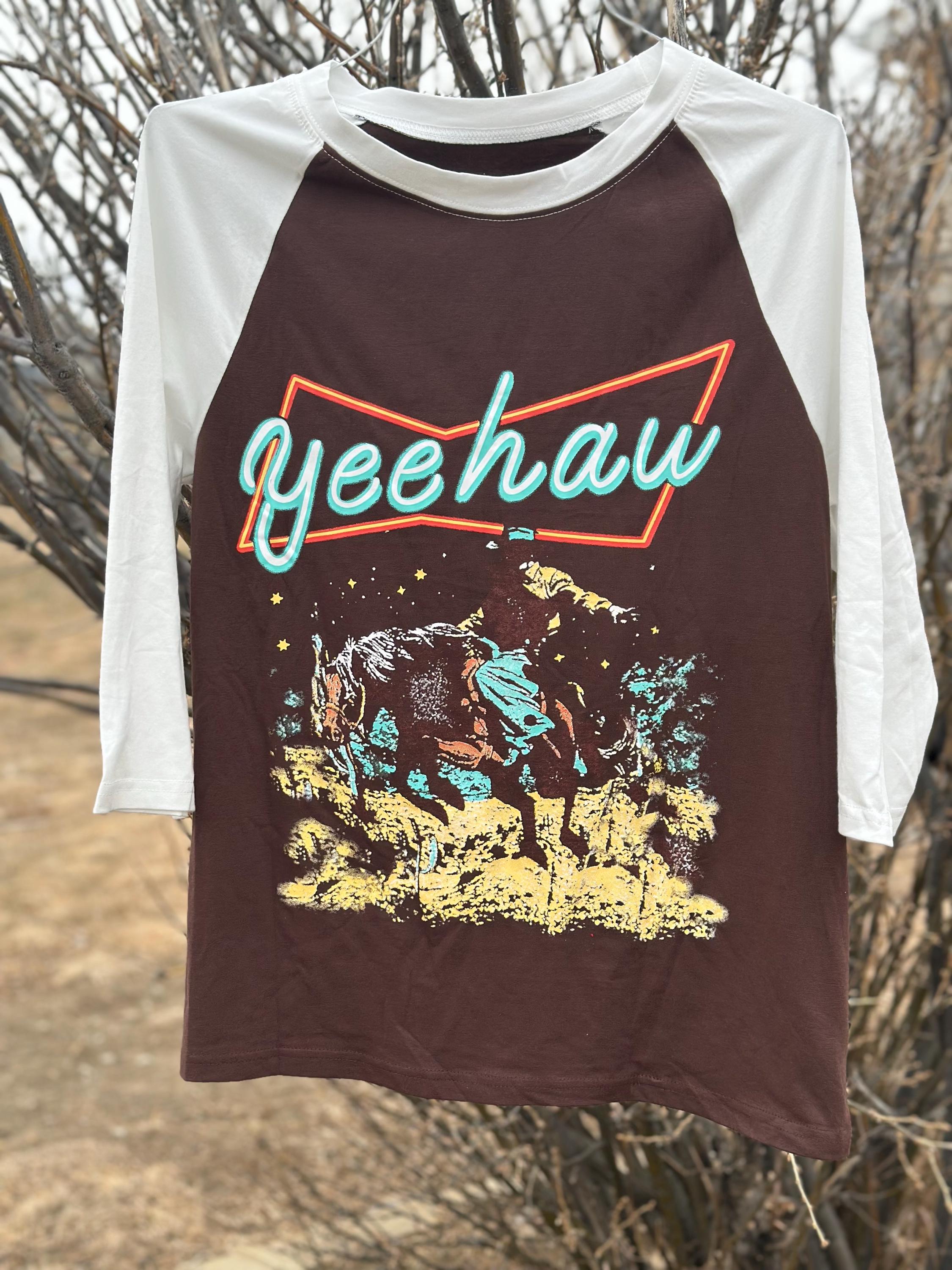 Add some cowgirl flair to your wardrobe with this YEEHAW Shirt Women love! This Cowgirl Raglan Shirt blends Western charm with a sporty edge, making it the perfect Women's Western tshirt for rodeos, casual days, or just showing off your cowgirl spirit.

✔️ Bold Western Graphic – The eye-catching “Yeehaw” design makes a statement wherever you go.
✔️ Classic Raglan Sleeves – A relaxed, sporty fit that’s both flattering and comfortable.